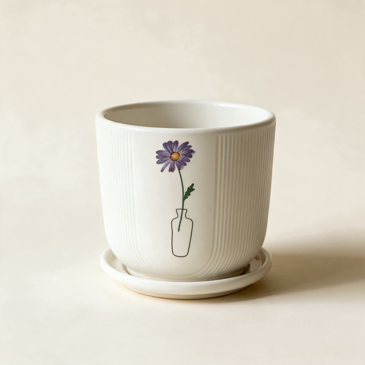 White ribbed ceramic planter with a small printed purple daisy standing in a thin line-drawn vase, on a matching white saucer, on a warm off-white background